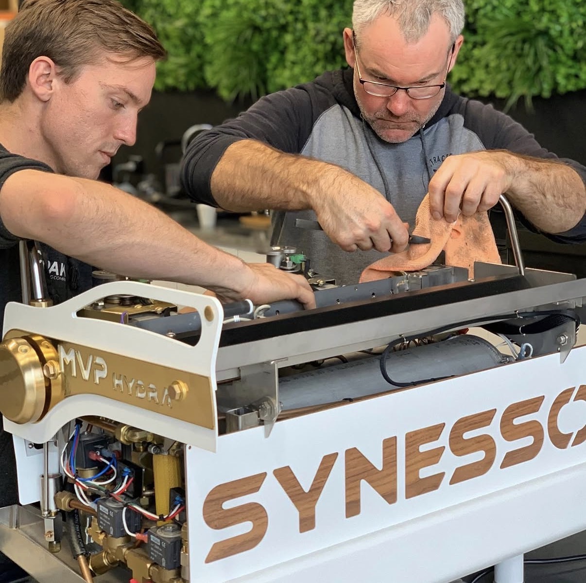 Xtracted technicians servicing a Synesso MVP Hydra